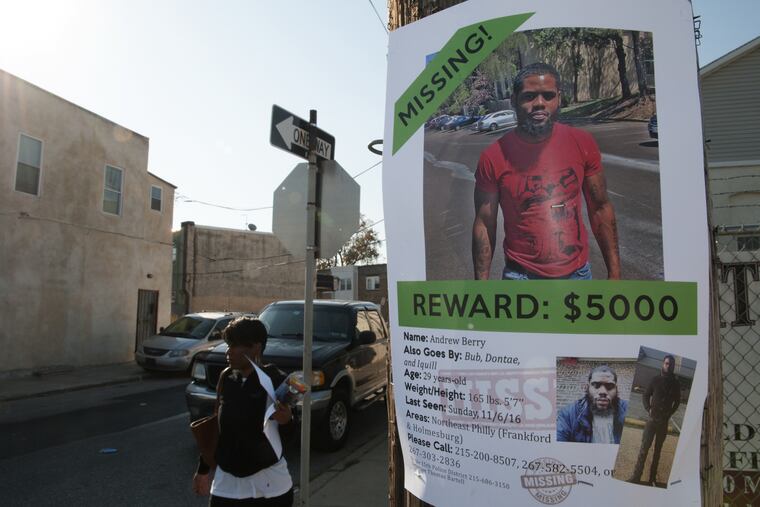 A poster on light pole on Ditman Street asking for information on Andrew Berry, whose body was found in a wooded area near Byberry Creek and Archbishop Ryan High School.
