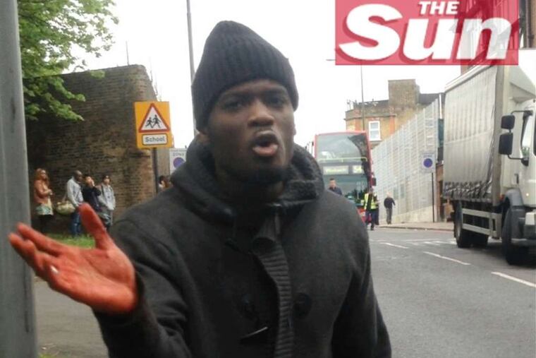 A man believed to be one of the attackers talks about the daylight assault in London on Wednesday in this image taken from video.
