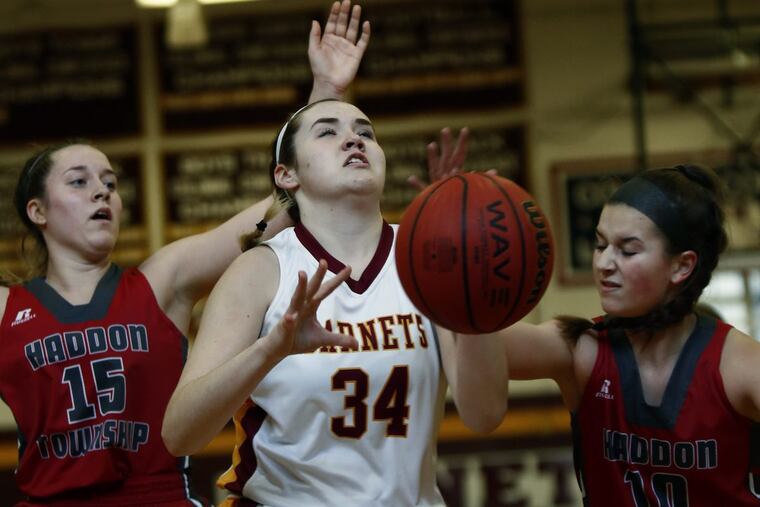 Haddon Heights' Sumer DeNinno (34) loses control of the ball when she's double-teamed by Haddon Township's Madison Bradley (15) and Karlee Hart in the first quarter of a South Jersey Group 1 girls' basketball semifinal Saturday, March 4, 2017 at Heights. Township went on to win, 45-32.