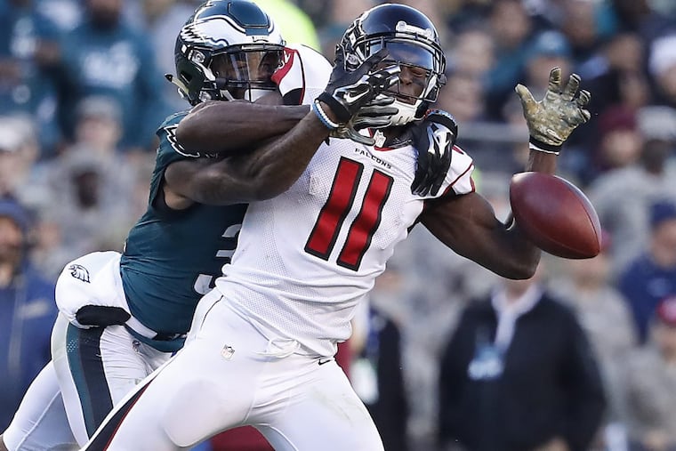 The Eagles’ Jalen Mills, left, was called for pass interference as he defended a pass intended for the Falcons’ Julio Jones during the teams’ meeting in November 2016.