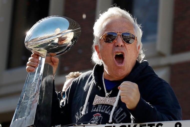 New England Patriots owner Robert Kraft yells to fans during their Super Bowl victory parade through downtown Boston earlier this month.