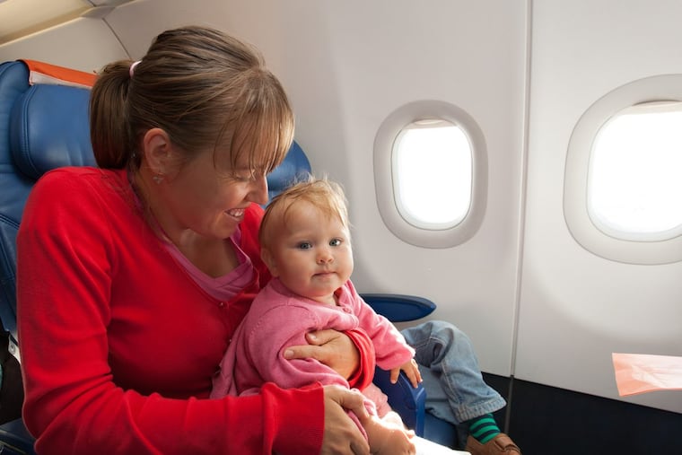 mother and little daughter travel by plane, family travel