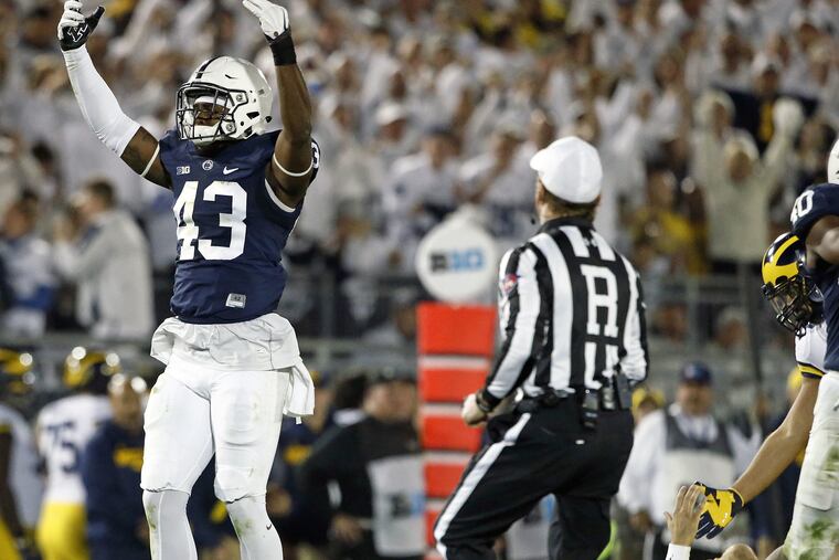 Penn State's Manny Bowen (43) celebrates after a sack against Michigan during the second half of an NCAA college football game in State College last October.