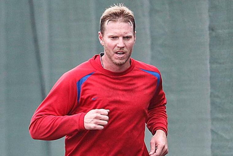 Roy Halladay walked off the mound and found pitching coach Rich Dubee before reaching the foul line. He smiled. (Yong Kim/Staff Photographer)