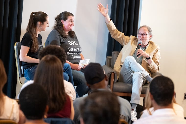 Aubrey Paris (left) and Emily Black, creators and hosts of the "National Treasure Hunt" podcast, speak with “National Treasure” director Jon Turteltaub during a live recording at the Independence Visitor Center in Philadelphia on Friday. The event was part of Philadelphia’s first National Treasure Weekend.
