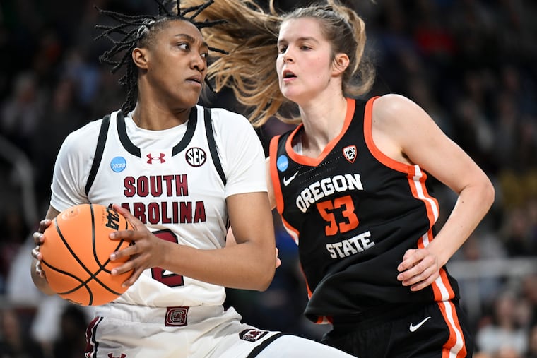 South Carolina forward Ashlyn Watkins drives against Oregon State forward Kelsey Rees in Albany, N.Y.