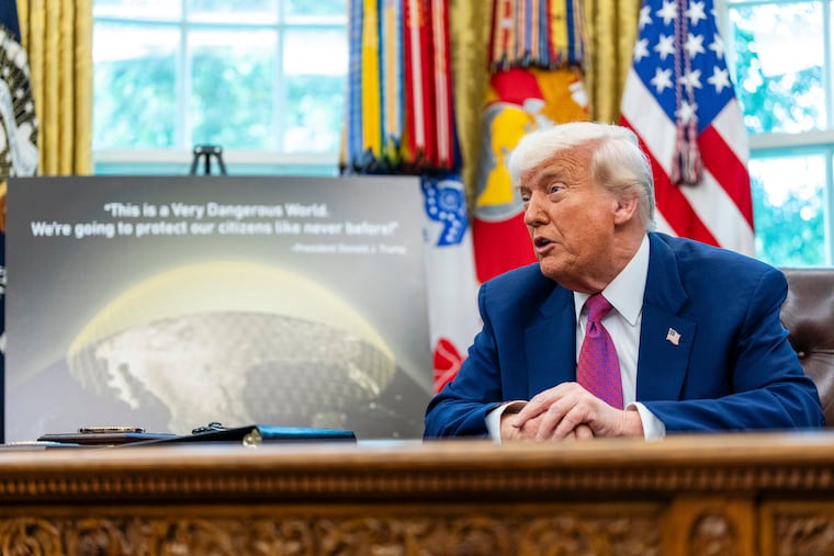 FILE — President Donald Trump holds an announcement for his so-called “Golden Dome” missile defense shield in the Oval Office of the White House in Washington, May 20, 2025. President Trump’s proposed national missile defense system, which he calls “Golden Dome,” would cost taxpayers $1.2 trillion over 20 years, according to a new government report.