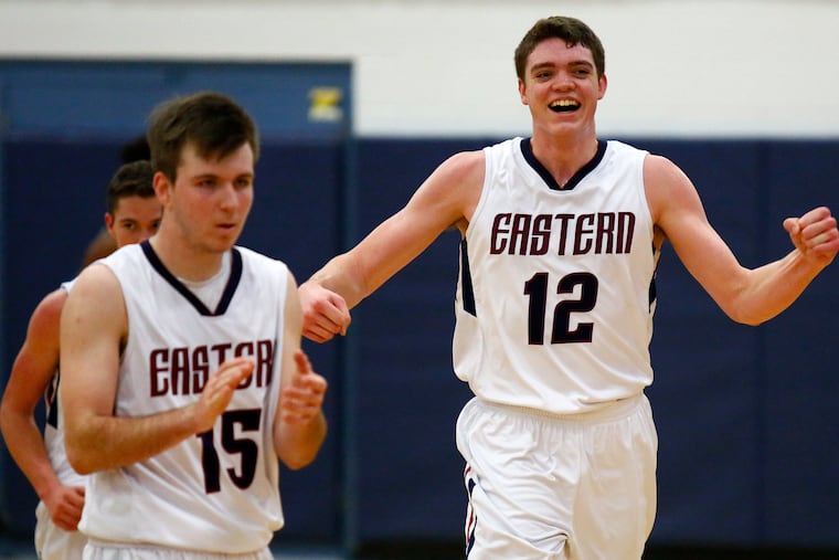 Ryan Ems (right) scored 18 points as Eastern cruised past Mainland, 73-52, in the Jimmy V Classic.