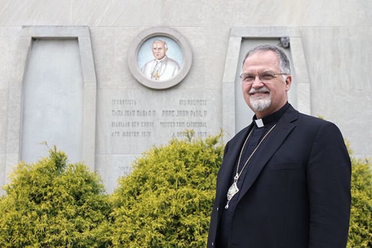 Archbishop Stefan Soroka stands in front of the mosaic of Pope John Paul II, who visited the Ukrainian Catholic Cathedral of the Immaculate Conception in Philadelphiia in1979. Soroka will travel to Rome on Thursday to attend the canonization ceremony of John Paul II. (April 23, 2014) ( DAVID MAIALETTI / Staff Photographer )