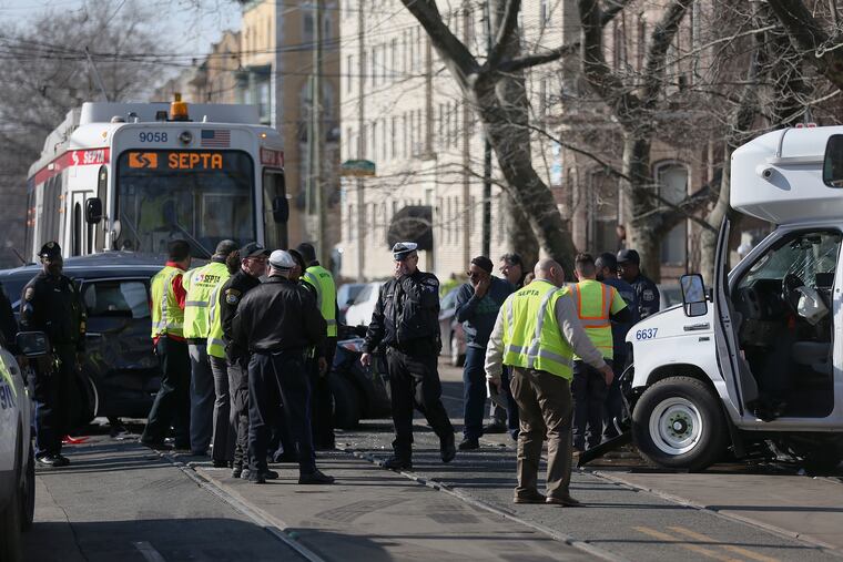 Officials investigate a crash that involved an SUV, a paratransit bus and a SEPTA trolley at South 41st Street and Chester Avenue in West Philadelphia on Tuesday, Feb. 5, 2019.