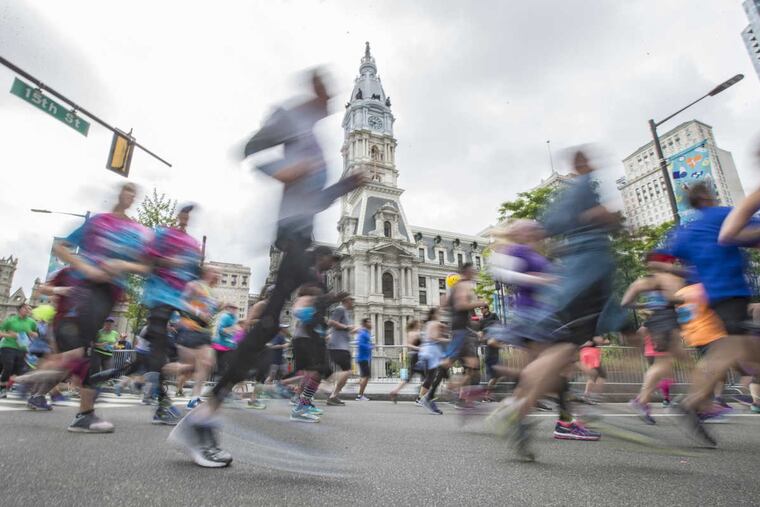 Some of the 40,000 runners in the 2017 Broad Street Run pass City Hall on their way to the finish in South Philadelphia.