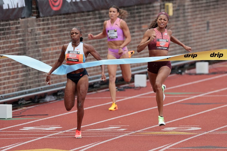 Gabby Thomas (right) finishes second to Melissa Jefferson-Wooden (far left) in the women’s 200-meter race during the Grand Slam Track meet at Penn’s Franklin Field on Saturday.