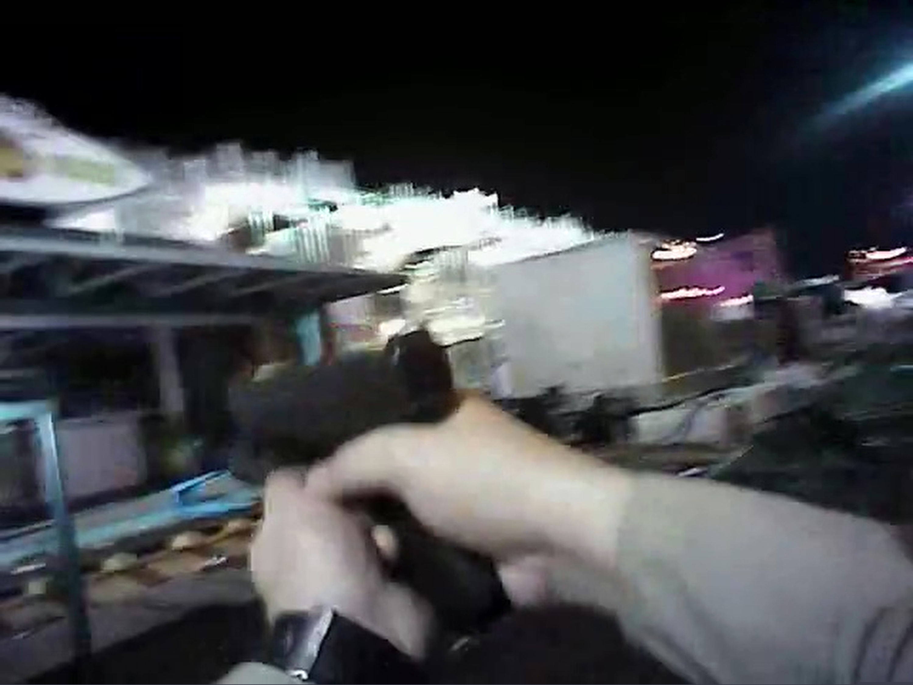 FILE - In this Sunday, Oct. 1, 2017, file image taken from police body cam video released by the Las Vegas Metropolitan Police Department on July 25, 2018, an armed law enforcement official points his gun while searching for a shooter in Las Vegas. Police in Las Vegas said Thursday, Jan. 3, 2019, they have finished releasing audio, video and written records about the investigation of the deadliest mass shooting in modern U.S. history. (Las Vegas Metropolitan Police Department via AP, File)