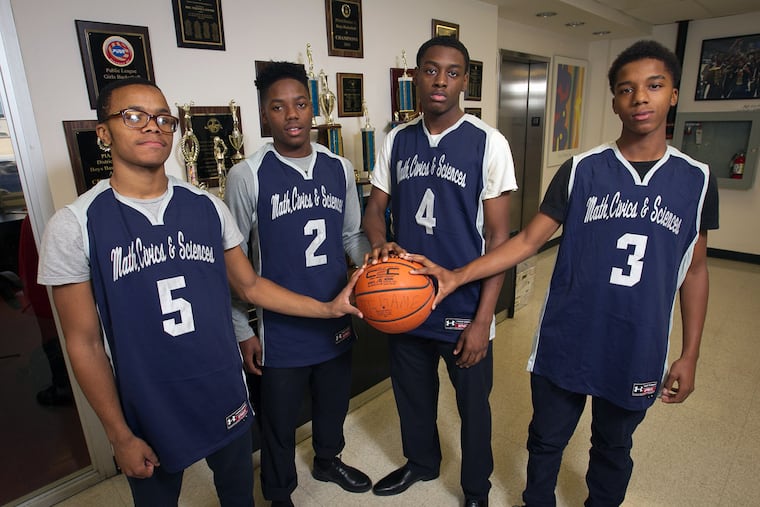 From left, junior Saheed Peoples, 16; junior Tymair Johnson, 17; senior Darrin Manning, 17; and freshman Ja'Quill Stone.