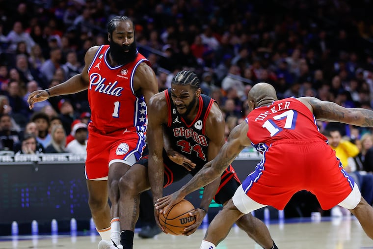 Sixers guard James Harden (1) and forward P.J. Tucker defend Chicago Bulls forward Patrick Williams in the first quarter.