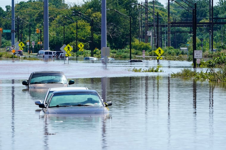 Vehicles are under water during flooding in Norristown on Sept. 2, 2021, in the aftermath of downpours and high winds from the remnants of Hurricane Ida that hit the Philadelphia area.
