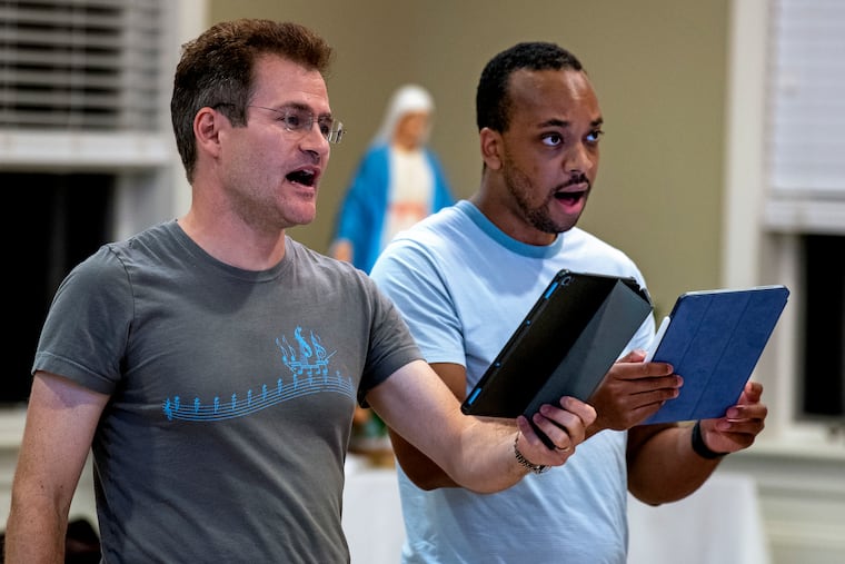 Nicholas Weininger (left) and Julian Dorsey (right) sing at St. Paul's Church in Stone Harbor Oct. 7, 2021, as Coro Mundi holds their first in person rehearsal since emerging from its coronavirus cocoon to once again sing together. The choir made its debut in 2018 in Italy, and had planned for another tour in summer 2020.
