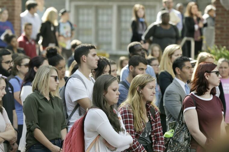 Mourners at a vigil for slain 22-year-old Temple University student Jenna Burleigh at the school’s Founder’s Garden.