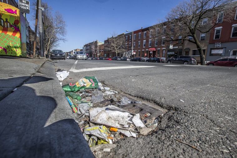 Trash that has collected over a storm drain on South Broad Street near Morris Street on Wednesday February 28, 2018.