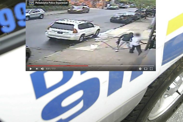 An image from the surveillance video showing the suspect with an AK-47 assault rifle.