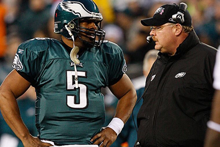Donovan McNabb talks with Andy Reid.