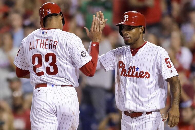 Phillies’ Aaron Altherr and Nick Williams celebrate their run scored against the Houston Astros on Wednesday, July 26, 2017 in Philadelphia. YONG KIM / Staff Photographer.