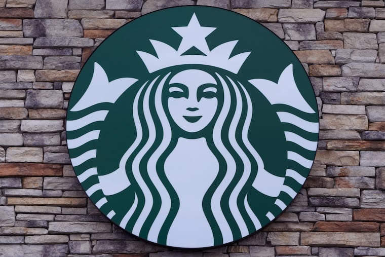 A Starbucks sign is displayed on a store in Salem, N.H.