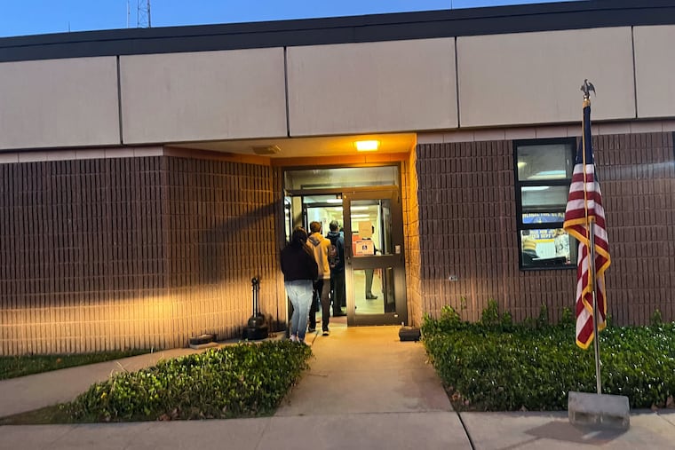 The line to vote extends out the door at the Groveville Fire Company polling location in Mercer County, where the Dominion voting machines were down all day Nov. 8.