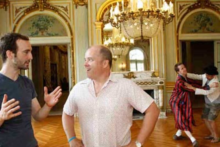 Actor Ben Lloyd (right), who conceived White Pines Productions, talks with Dave Johnson of the troupe Berserker Residents. Bradley Wrenn and Justin Jain cavort in the background. On Saturday, the Berserkers will perform work they created this week. (Charles Fox / Staff Photographer)