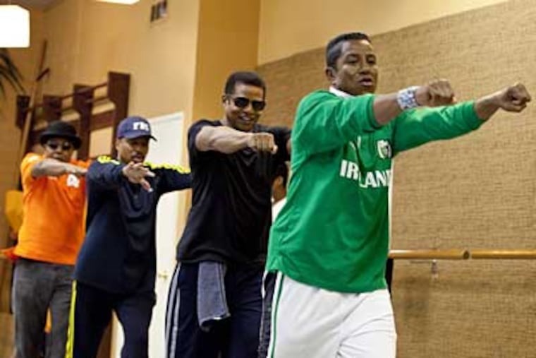 From left: Tito, Marlon, Jackie and Jermaine Jackson rehearse in Los Angeles. A new reality show, "The Jacksons: A Family Dynasty" premieres Sunday on A&E. (AP Photo/A&E, Richard Knapp)