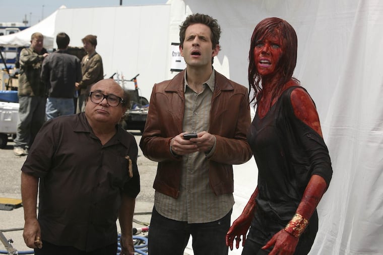 Danny DeVito (from left), Glenn Howerton, and Kaitlin Olson on the set of a fake M. Night Shyamalan movie for the season 5 episode "Mac and Charlie Write a Movie."