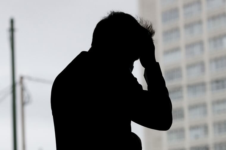 A silhouette of Ahmad in Center City Philadelphia on Saturday August 28, 2021. His full name is being withheld, and his face hidden here, in order to protect family members still in Afghanistan.