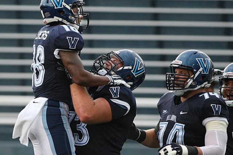 Villanova's Poppy Livers gets lifted in the air by teammate Ross Hall after Livers scored on a pass play. (Michael Bryant/Staff Photographer)