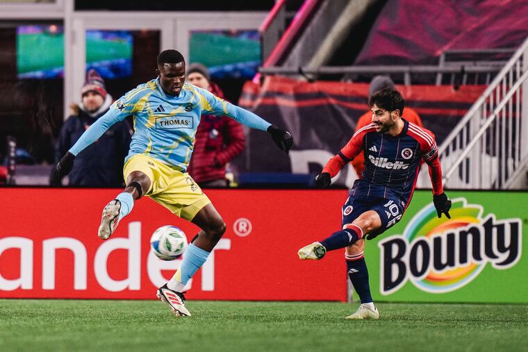Olwethu Makhanya (left) on the ball in front of New England's Carles Gil during the first half of the Union's win at the Revolution on Saturday,