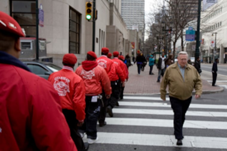 After forging an agreement with Philadelphia and SEPTA police on subway patrols yesterday, members of the Guardian Angels walked in a line along Market Street toward City Hall.