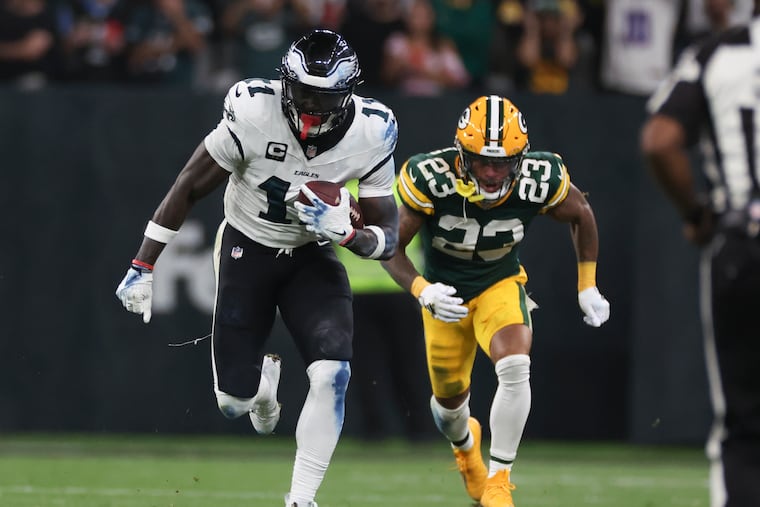 Eagles wide receiver A.J. Brown runs with the football past Green Bay Packers cornerback Jaire Alexander during the second quarter in the season opener at Corinthians Arena in São Paulo, Brazil on Friday, Sept. 6, 2024.