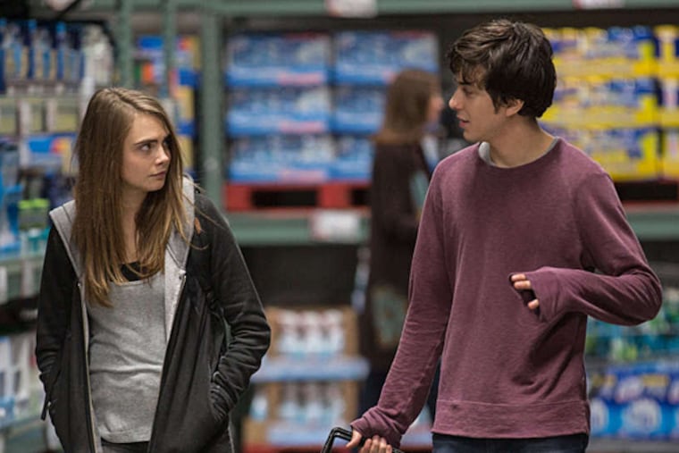 Cara Delevingne, left, as Margo, and Nat Wolff as Quentin, in a scene from the film, "Paper Towns." (Michael Tackett/Twentieth Century Fox via AP)