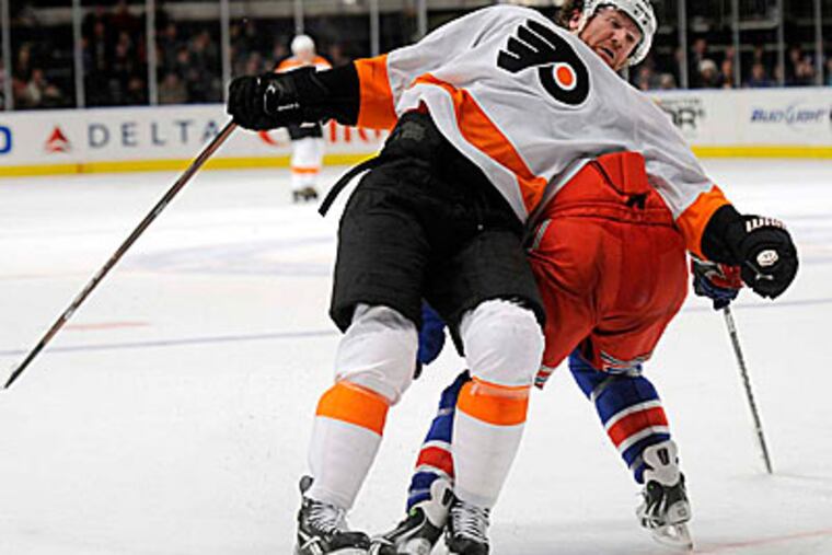 Scott Hartnell gets lifted off his feet by the Rangers' Carl Hagelin in the second period on Friday. (Henny Ray Abrams/AP)