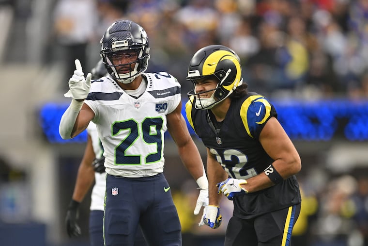 Josh Jobe (left) has helped limit Puka Nacua and other top NFL receivers this season.