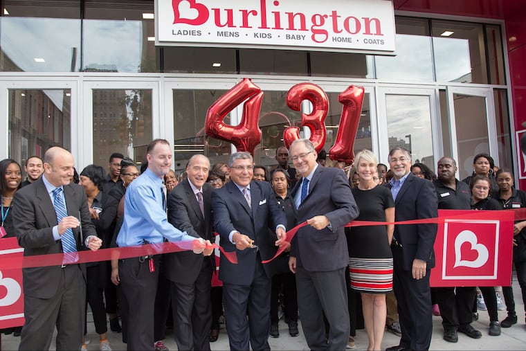 Fred Hand, Chief Customer officer Burlington Stores, cutting the ribbon, and David Coder, Executive Vice President of Stores, right of man cutting ribbon, at the grand opening of the new Burlington Store at 833 Market Street, in Philadelphia, Sept. 22, 2017. Burlington ranks 459 on the Fortune 500 list.