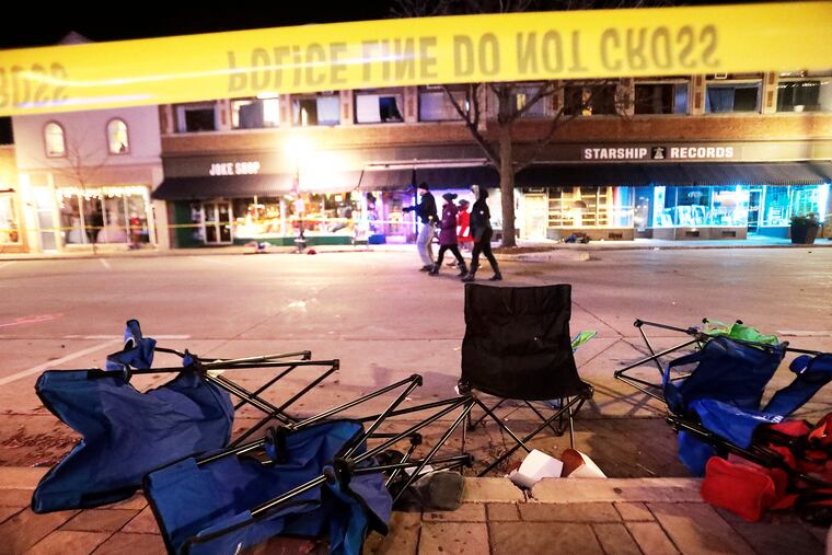 Toppled chairs line W. Main St. in downtown Waukesha, Wis., after an SUV drove into a parade of Christmas marchers on Sunday.