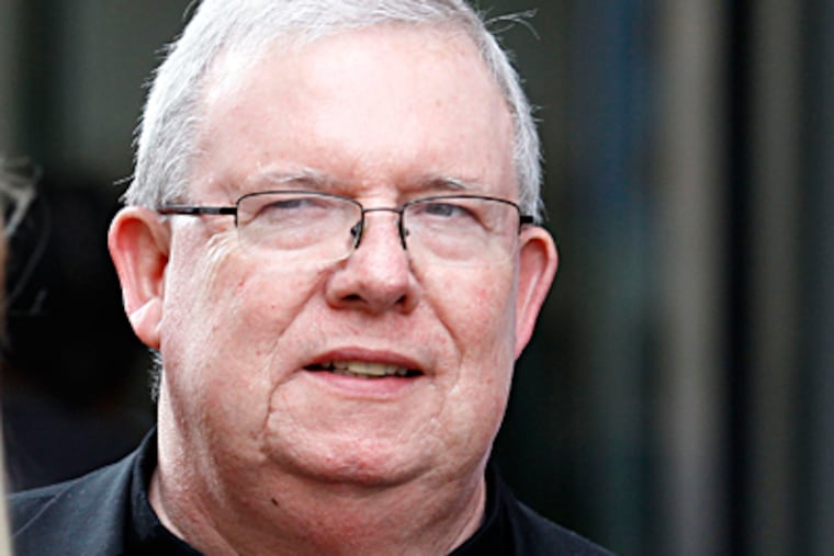 Msgr. William J. Lynn leaves the Criminal Justice Building after testifying in the clergy abuse trial. He denied knowingly putting children in harm's way. YONG KIM / Staff Photographer