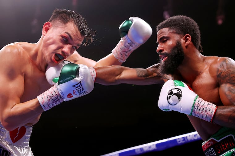 Brandon Figueroa, left, battling Stephen Fulton in the super bantamweight world champion fight at the Park MGM Park Theater in Las Vegas on Nov. 27, 2021.