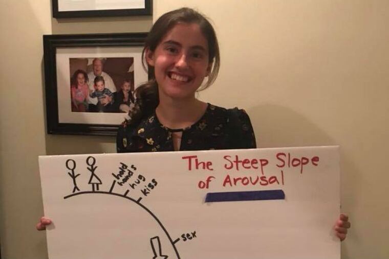 Abby McElroy, 17, holds a poster from the sex ed class presented by Amnion Crisis Pregnancy Center at Strath Haven High School for the past three years. The school board said it was investigating.