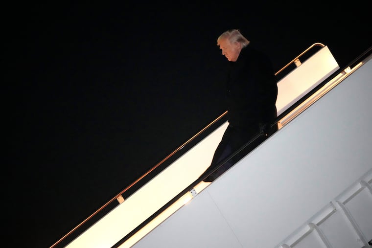 President Donald Trump steps off Air Force One, early Monday, Feb. 9, 2026, at Joint Base Andrews, Md., after returning from a trip to Florida.