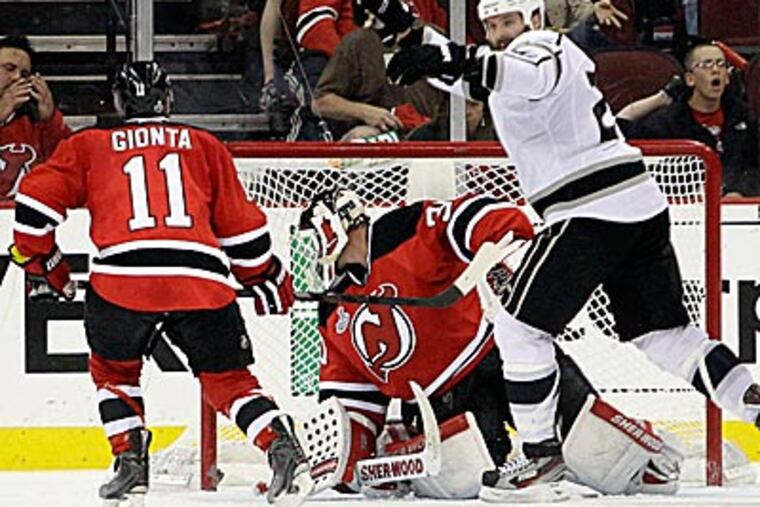 Kings' Dustin Penner celebrates after teammate Jeff Carter scored a goal in overtime. (Frank Franklin II/AP)
