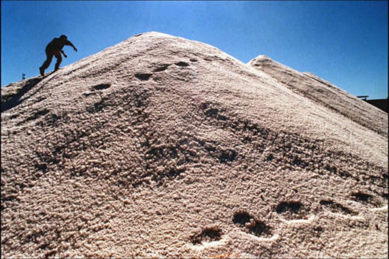 A salt stockpile on bank of the Schuykill to be sold to town and state highway departments; Camden County is buying salt in bulk for the majority of its towns to save them money.