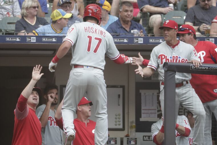 Phillies left fielder Rhys Hoskins celebrates with teammates after hitting a solo home run in the Phillies' win on Saturday.