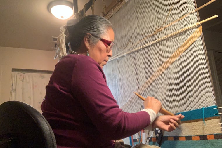 TahNibaa Naataanii at her loom.
.