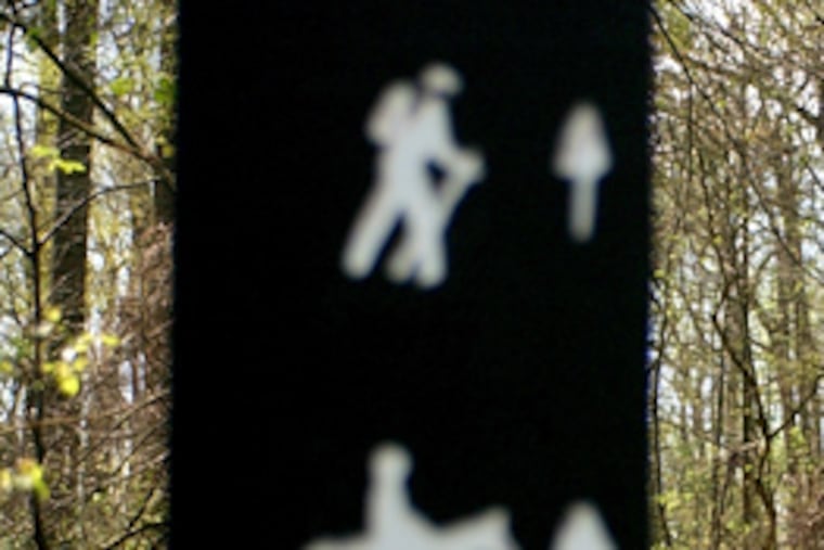 A trail marker along Fairmount Park's Forbidden Drive. (Tom Gralish / Staff File Photo)